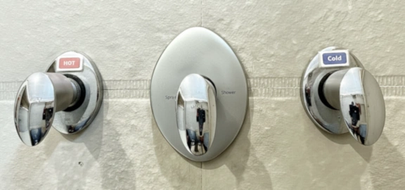Close-up of the hot water tap or mixer in one of the bathrooms